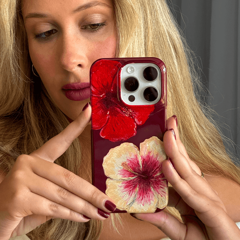 The Dairy BG Studio Hibiscus Flower Phone Case with a vibrant hibiscus flower design offering stylish protection