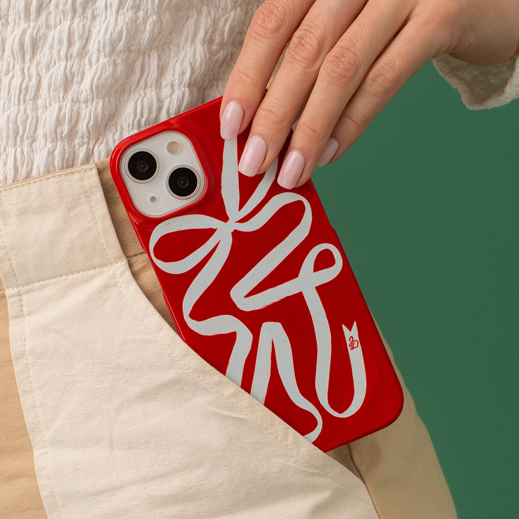 The Dairy Ribbon Phone Case with a stylish and elegant design, perfect for keeping your phone safe